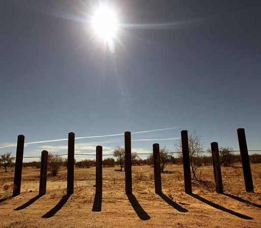TOHONO O'ODHAM NATION, AZ - JANUARY 18: The porous U.S. Mexico border fence stretches through the Sonoran Desert on January 18, 2011 in the Tohono O'odham Nation, Arizona. The Native American reservation, which stretches across 72 miles of the U.S.-Mexico border, is a key crossing point for narcotics entering the United States. (Photo by John Moore/Getty Images)