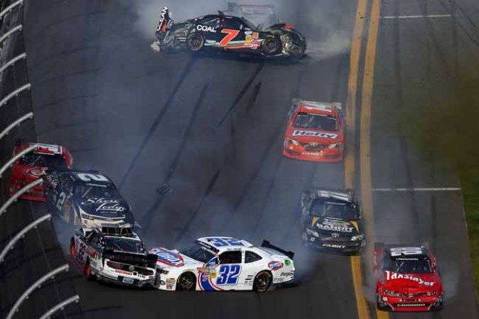 DAYTONA BEACH, FL - FEBRUARY 23: Kyle Larson, driver of the #32 Clorox Chevrolet, Justin Allgaier, driver of the #31 Brandt Chevrolet, Brian Scott, driver of the #2 Shore Lodge Chevrolet, Parker Kligerman, driver of the #77 Bandit Chippers Toyota, and Brad Keselowski, driver of the #22 Discount Tire Dodge, are involved in an incident at the finish of the NASCAR Nationwide Series DRIVE4COPD 300 at Daytona International Speedway on February 23, 2013 in Daytona Beach, Florida. (Photo by Jonathan Ferrey/Getty Images)