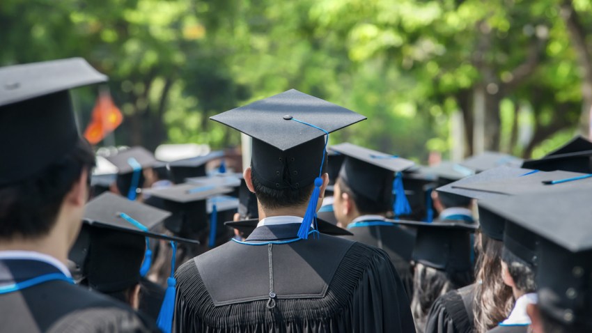 back of graduates during commencement at university