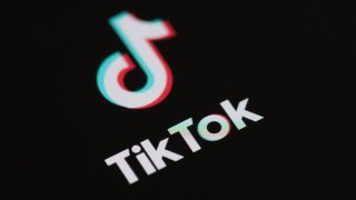 This May 27, 2020, photo taken in Paris shows the logo of the social network application TikTok on the screen of a phone.