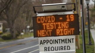 A digital sign directs patients to the drive-thru coronavirus test site