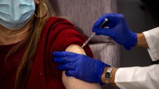 Susan Maxwell-Trumble, a 67-year-old from Babylon, receives a dose of the Johnson & Johnson Covid-19 vaccine at Northwell Health South Shore University Hospital in Bay Shore, New York, on Wednesday, March 3, 2021.