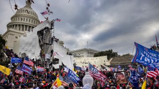 Trump supporters clash with police and security forces as people try to storm the US Capitol on January 6, 2021 in Washington, DC.