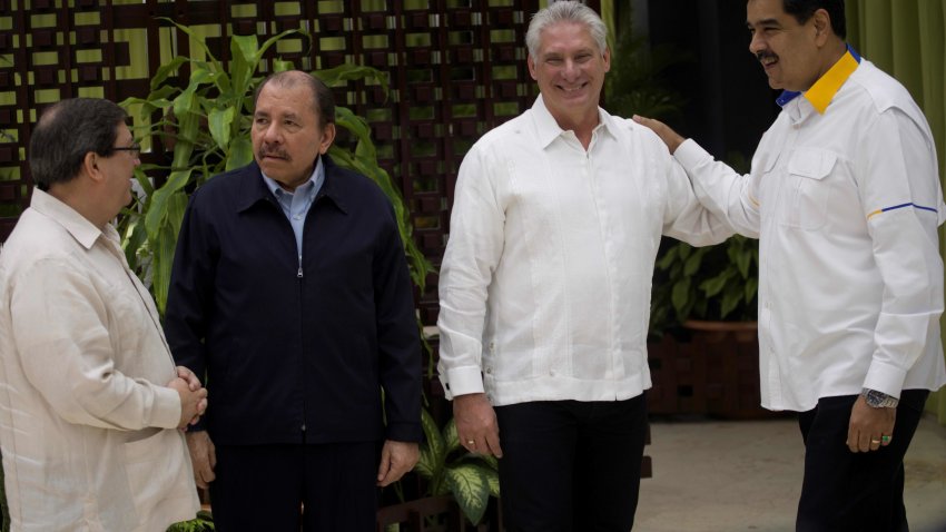 Venezuela’s President Nicolas Maduro (R), speaks with Cuban President Miguel Diaz-Canel next to Nicaragua’s President Daniel Ortega and Cuba’s Minister of Foreign Affairs Bruno Rodriguez (L) before the XVII ALBA-TCP Summit inauguration, in Havana on December 14, 2019. (Photo by RAMON ESPINOZA / POOL / AFP) (Photo by RAMON ESPINOZA/POOL/AFP via Getty Images)