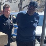 A man is being arrested on the street