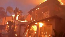 A home burns in the Coastal Fire in Laguna NIguel.