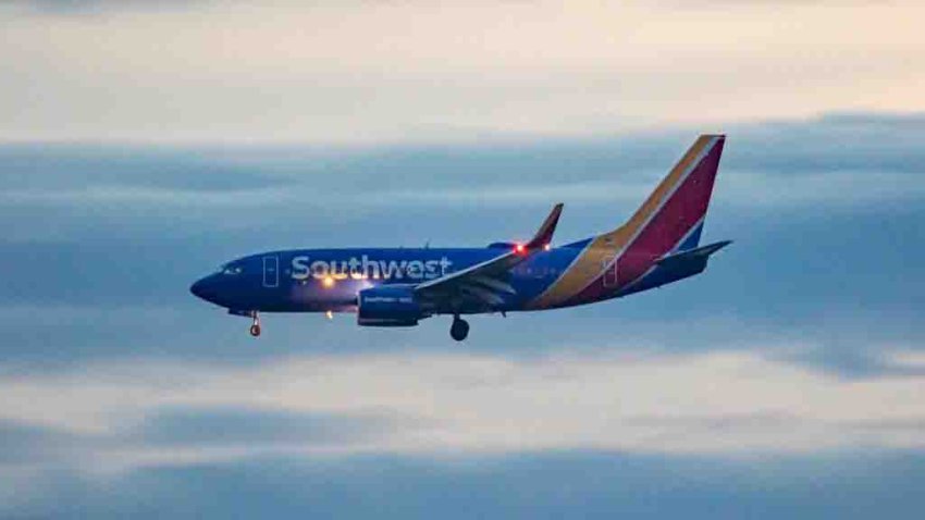 Southwest Airlines Boeing 737-700 aircraft as seen landing at dusk time at Ronald Reagan Washington National Airport DCA in Arlington County, Virginia over the Potomac River in the United States of America flying over water and buildings. The arriving B737 passenger airplane has the registration tail number N750SA and is powered by 2x CFMI jet engines. Southwest airline is the world’s largest low-cost carrier with headquarters in Dallas Texas a fleet size of 793 planes. Washington DC, USA on May 2023 (Photo by Nicolas Economou/NurPhoto via Getty Images)