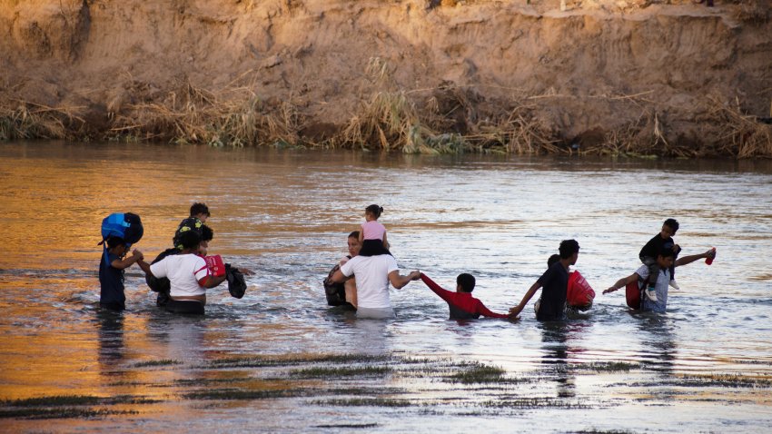 PIEDRAS NEGRAS, MEXICO – AUGUST 04: Migrants try to cross the border between Piedras Negras and Eagle Pass, in Piedras Negras, Mexico on August 04, 2023. The governor of Texas installed a barrier with floating buoys to prevent the crossing of migrants, near this facility the body of two Honduran migrants who drowned was found. They tragically lost their lives while attempting to cross the river. (Photo by David Peinado Romero/Anadolu Agency via Getty Images)