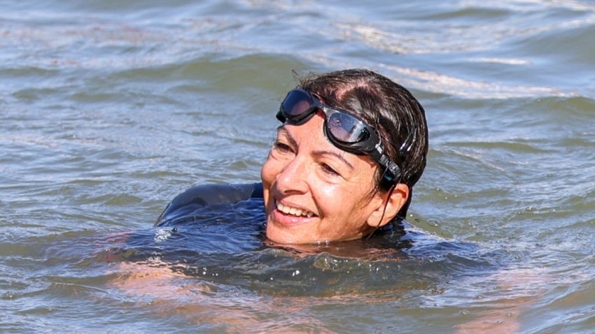 PARIS, FRANCE – JULY 17: Mayor of Paris Anne Hidalgo is seen swimming in the river Seine on July 17, 2024 in Paris, France. The city’s mayor took a dip in the Seine amid concerns over water cleanliness ahead of the Olympic Games, in which the river will host triathlon and marathon swimming events. (Photo by Pierre Suu/Getty Images)