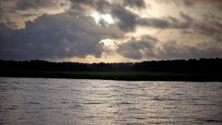 FILE - The sun rises over Sapelo Island, Ga.,