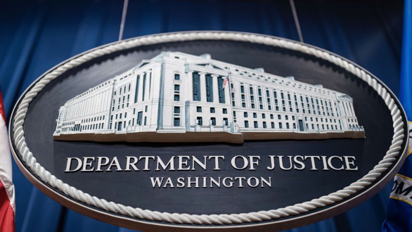 Seal of the US Department of Justice before a news conference in Washington, DC, US, on Tuesday, Jan. 24, 2023. The Justice Department and eight states sued Alphabet Inc.s Google, calling for the break up of the search giants ad-technology business over alleged illegal monopolization of the digital advertising market. Photographer: Al Drago/Bloomberg via Getty Images